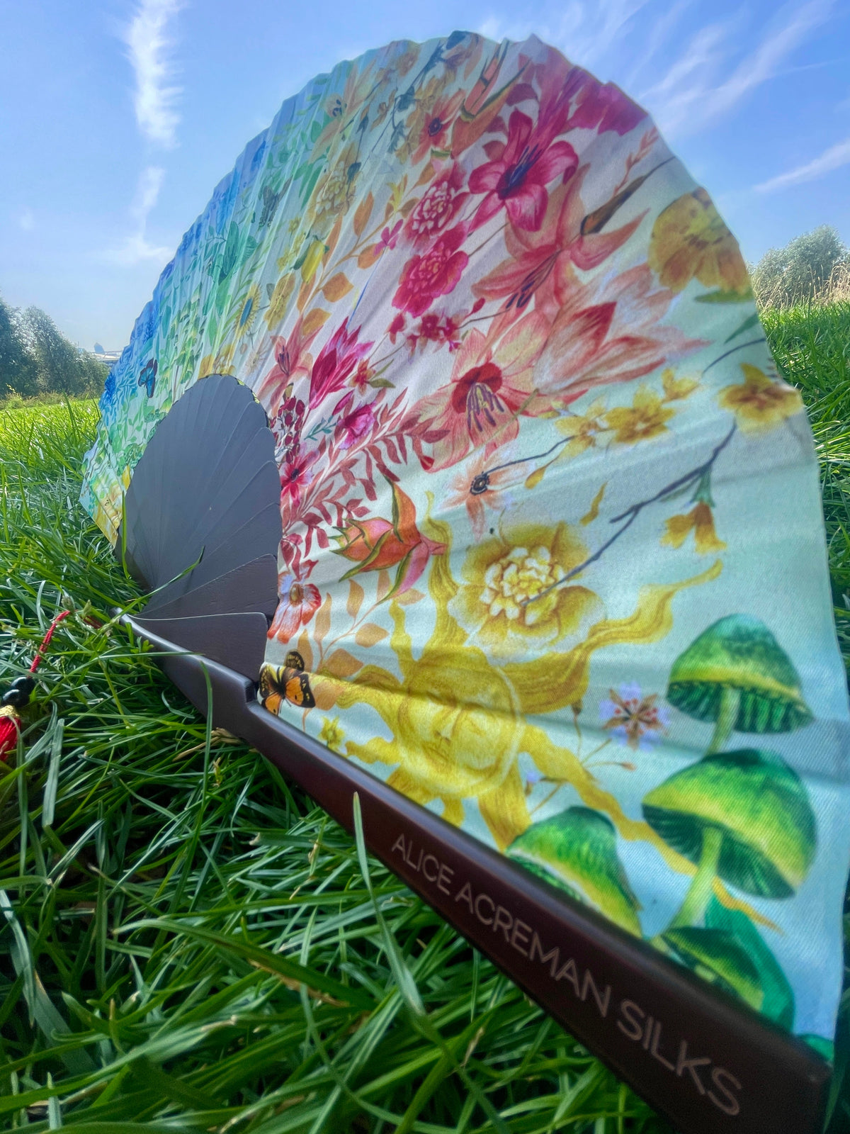 Colourful Silk folding hand fan 'kaleido-bloom' print with floral & nature filled rainbow design