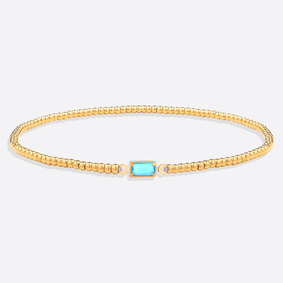 Pulsera de cuentas doradas con piedra natal