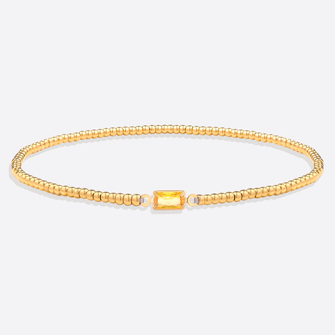 Pulsera de cuentas doradas con piedra natal