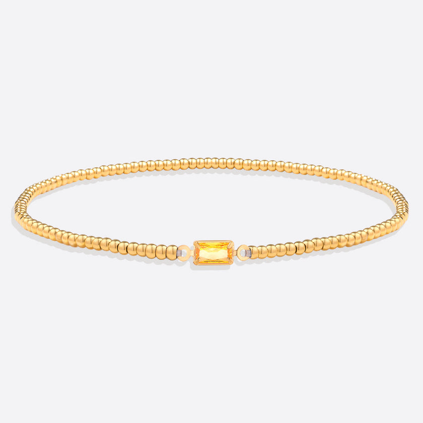 Pulsera de cuentas doradas con piedra natal