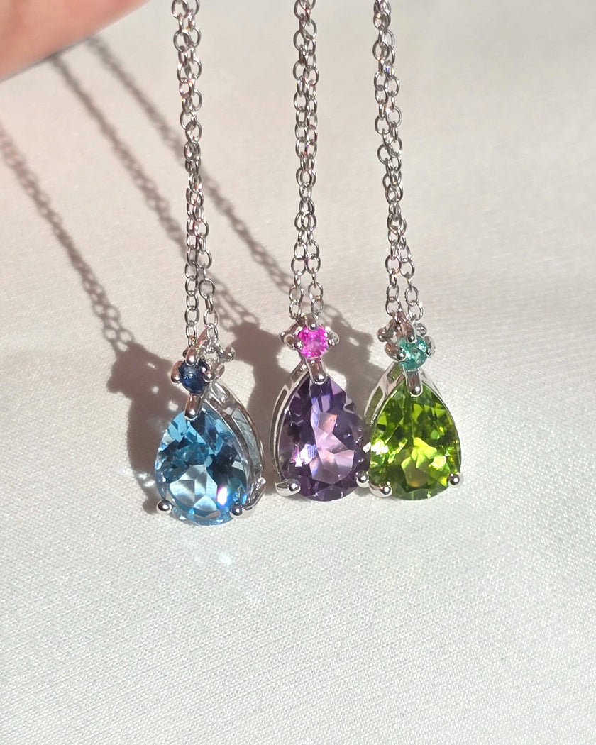 Halskette mit Anhänger mit rosa Rubin und Amethyst im Tropfenschliff aus Sterlingsilber