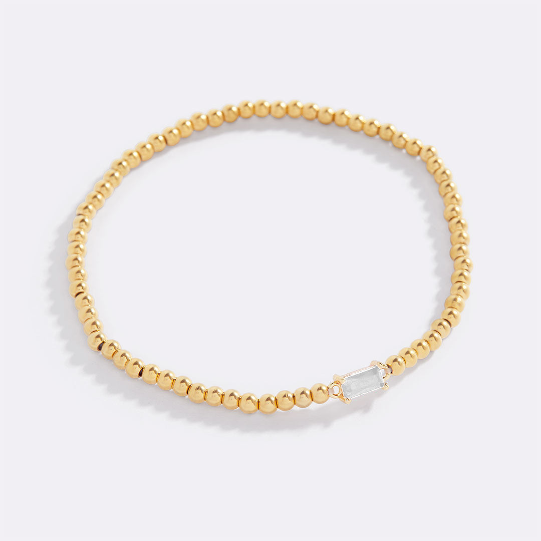 Pulsera de cuentas doradas con piedra natal