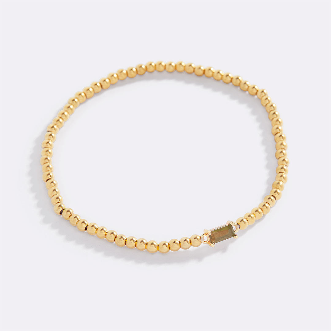 Pulsera de cuentas doradas con piedra natal