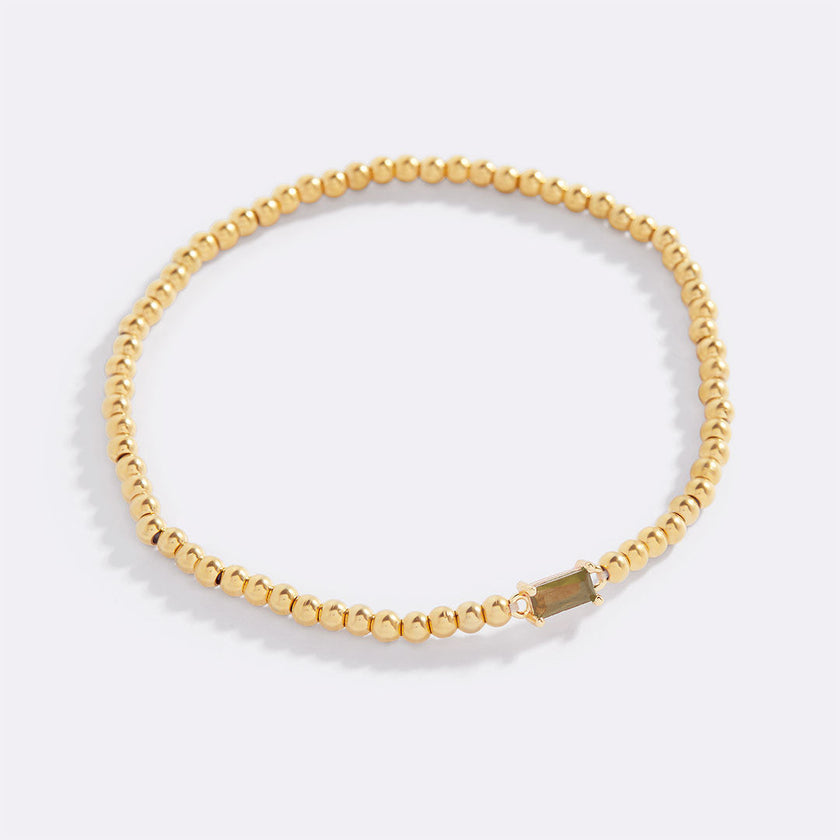 Pulsera de cuentas doradas con piedra natal