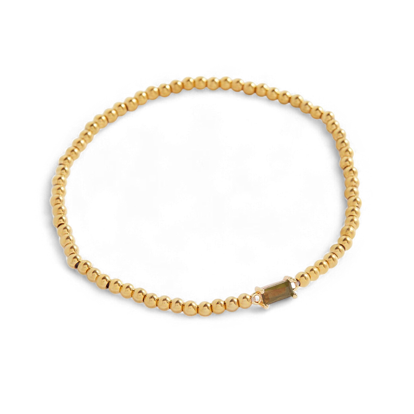 Pulsera de cuentas doradas con piedra natal