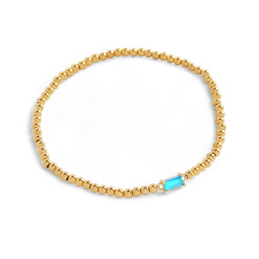 Pulsera de cuentas doradas con piedra natal