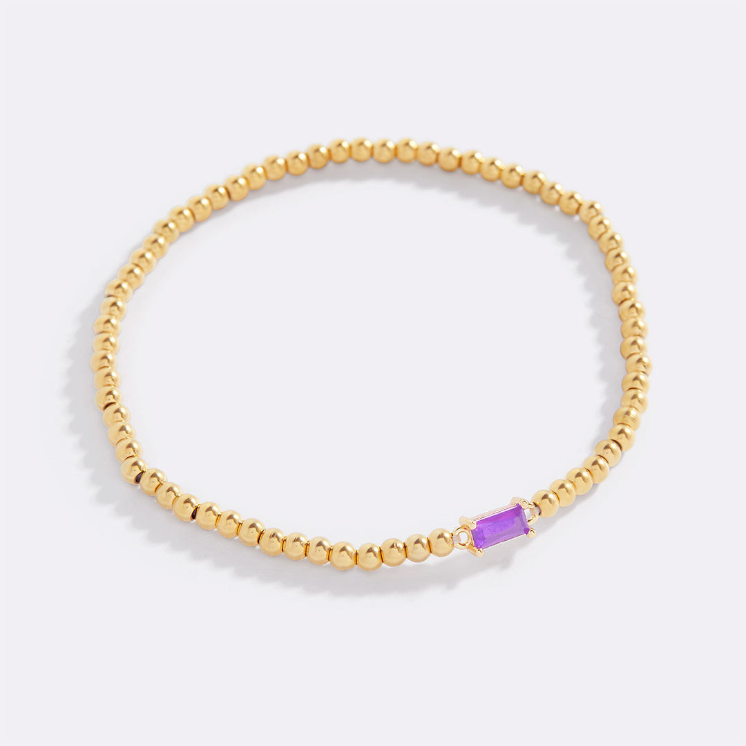 Pulsera de cuentas doradas con piedra natal