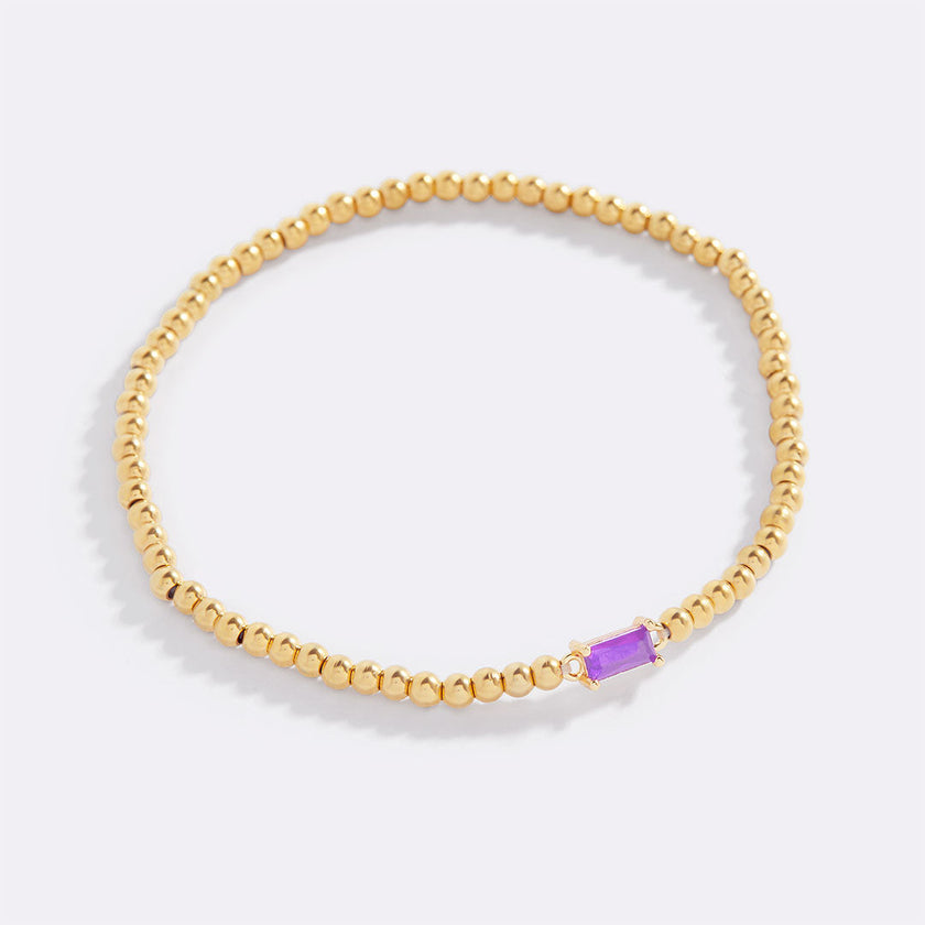 Pulsera de cuentas doradas con piedra natal