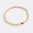 Pulsera de cuentas doradas con piedra natal