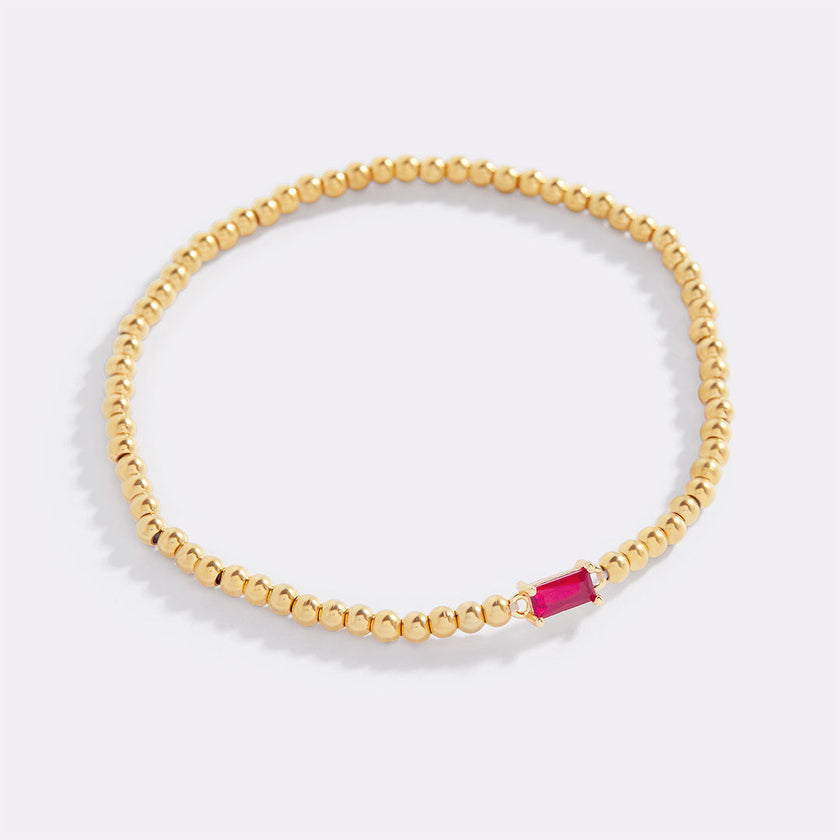 Pulsera de cuentas doradas con piedra natal