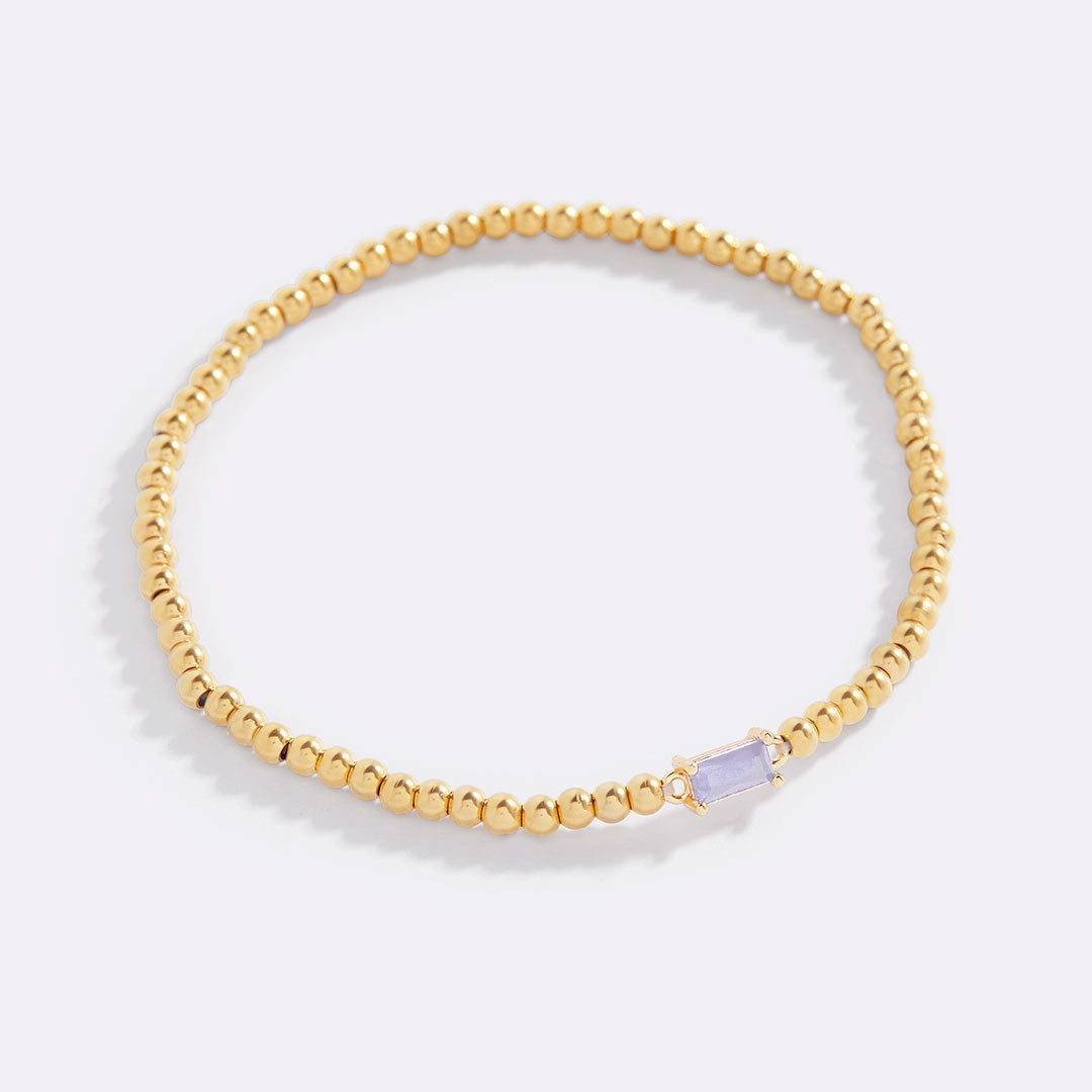 Pulsera de cuentas doradas con piedra natal