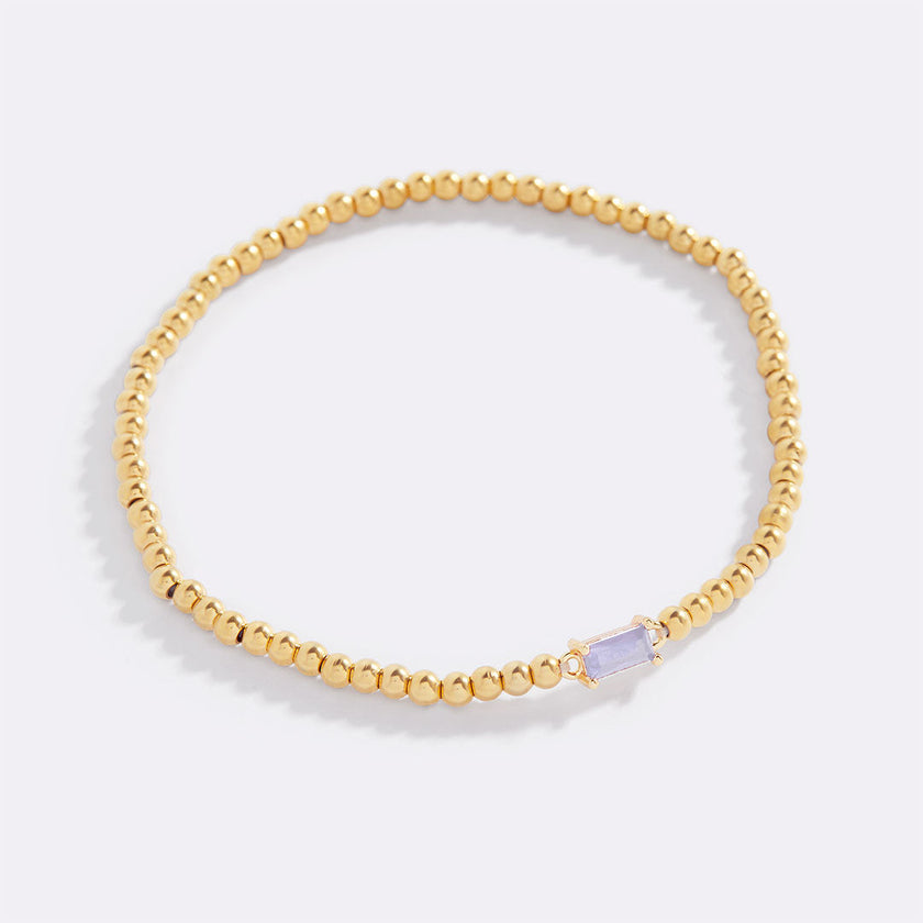 Pulsera de cuentas doradas con piedra natal