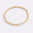Pulsera de cuentas doradas con piedra natal