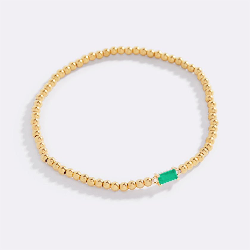 Pulsera de cuentas doradas con piedra natal