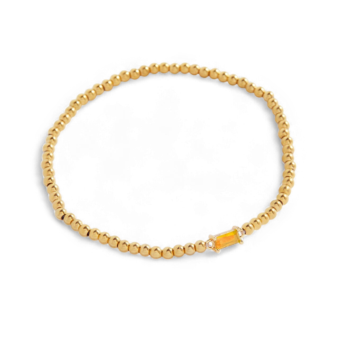 Pulsera de cuentas doradas con piedra natal