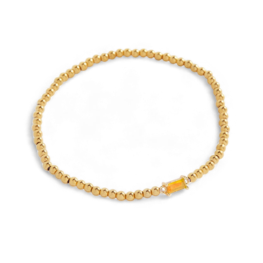 Pulsera de cuentas doradas con piedra natal