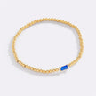 Pulsera de cuentas doradas con piedra natal