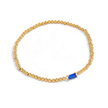 Pulsera de cuentas doradas con piedra natal