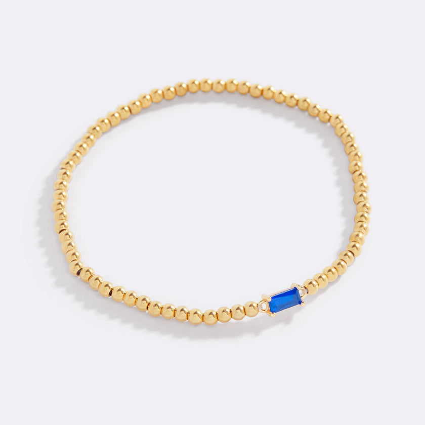 Pulsera de cuentas doradas con piedra natal