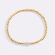 Pulsera de cuentas doradas con piedra natal