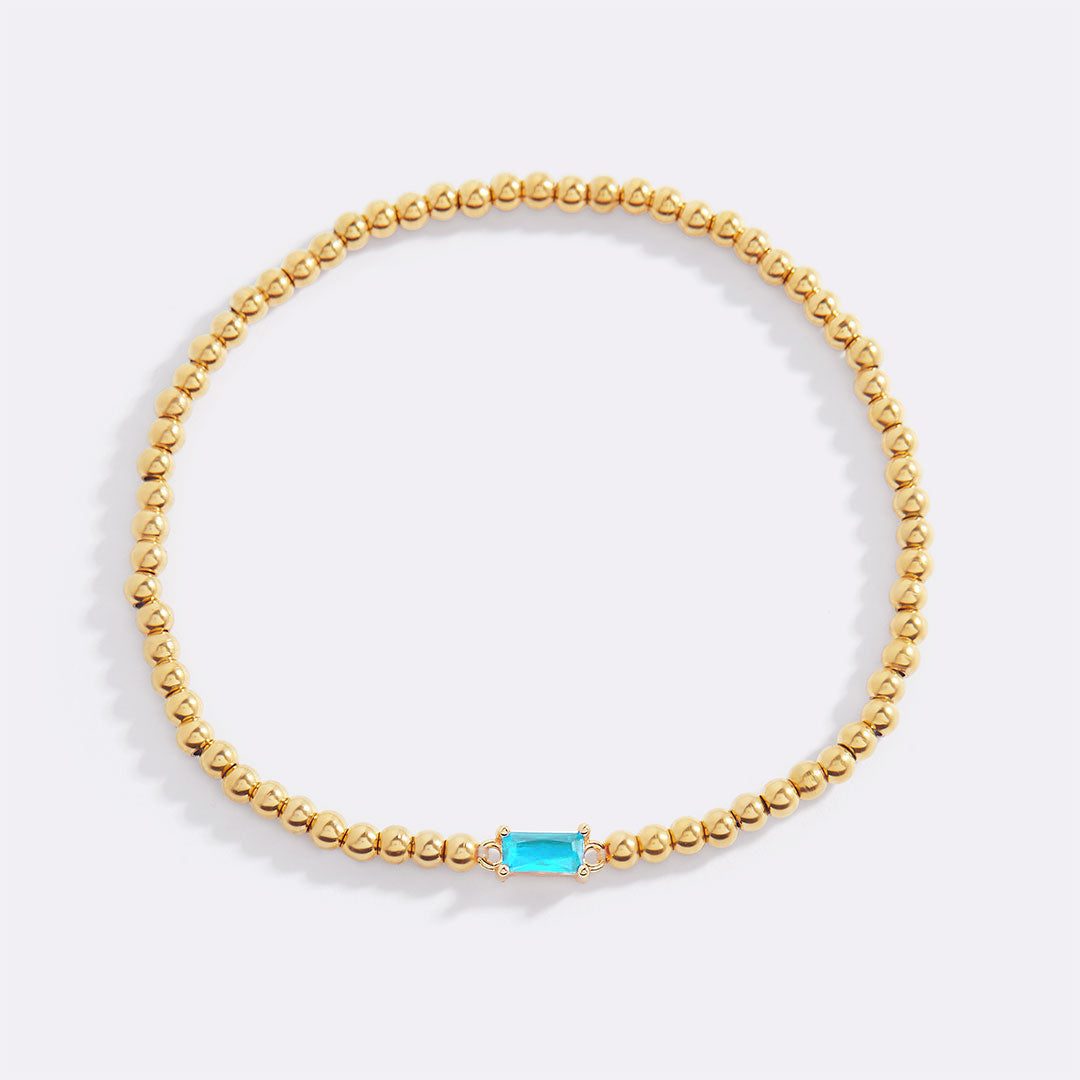 Pulsera de cuentas doradas con piedra natal
