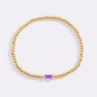 Pulsera de cuentas doradas con piedra natal