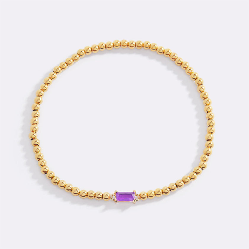 Pulsera de cuentas doradas con piedra natal