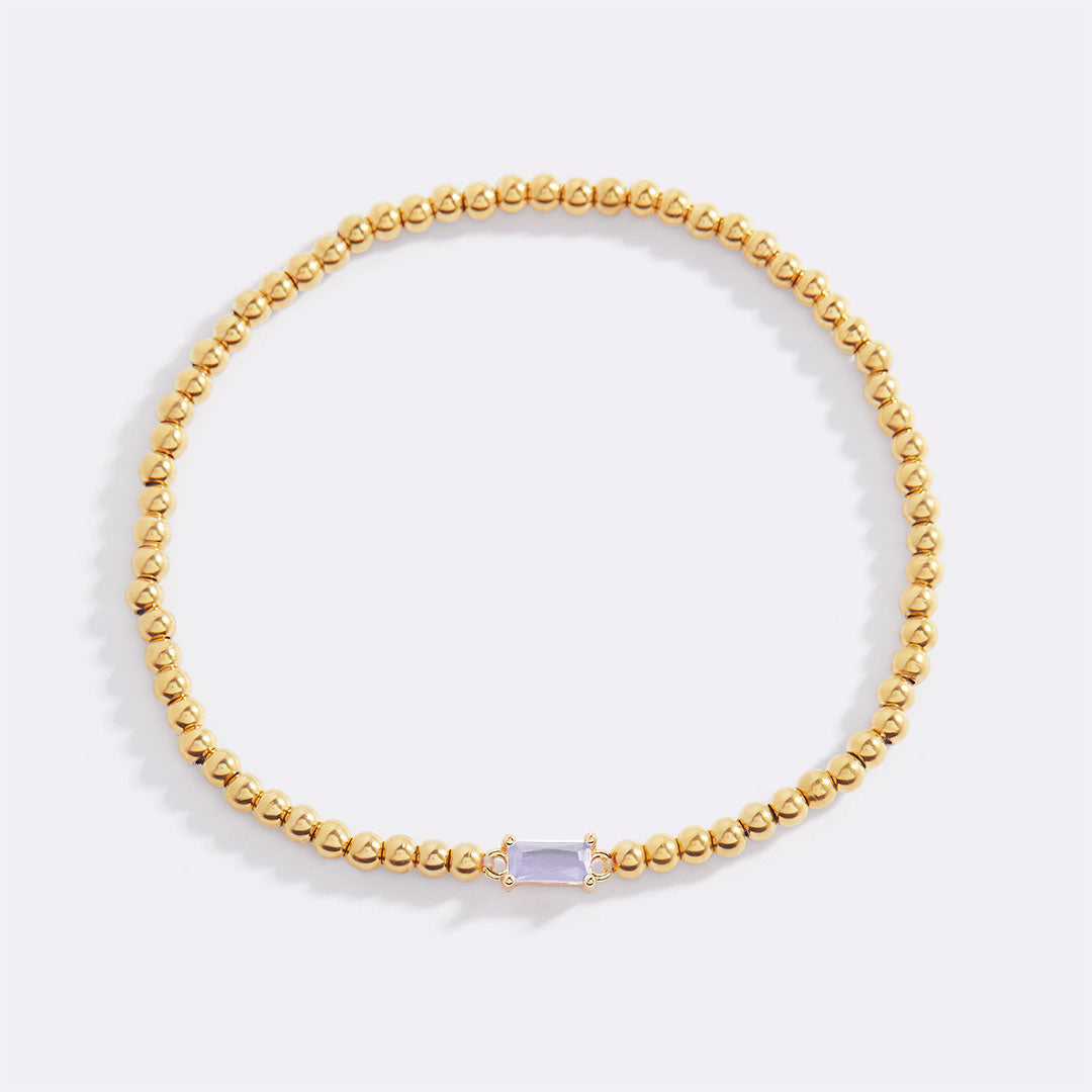 Pulsera de cuentas doradas con piedra natal