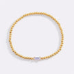 Pulsera de cuentas doradas con piedra natal