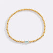 Pulsera de cuentas doradas con piedra natal