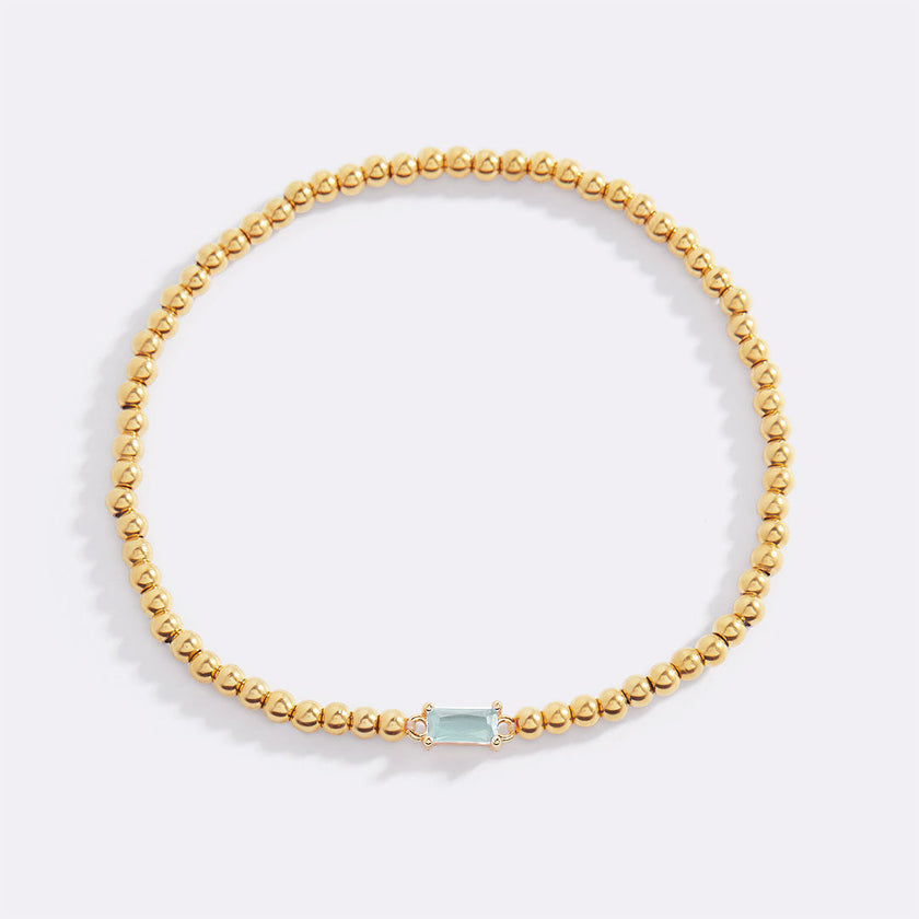 Pulsera de cuentas doradas con piedra natal