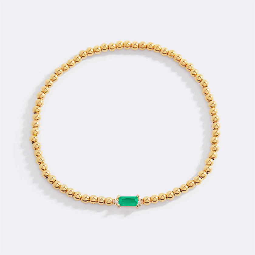 Pulsera de cuentas doradas con piedra natal
