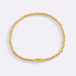 Pulsera de cuentas doradas con piedra natal