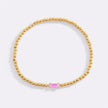 Pulsera de cuentas doradas con piedra natal