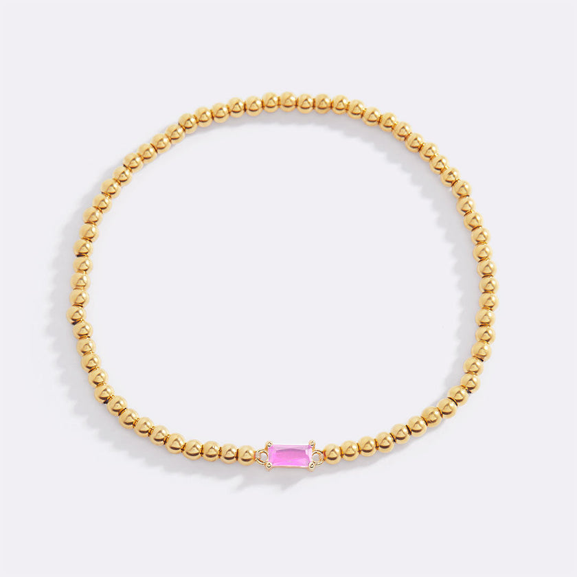 Pulsera de cuentas doradas con piedra natal
