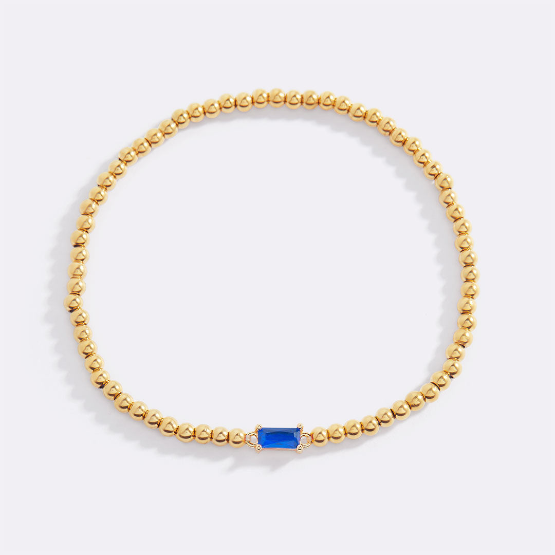 Pulsera de cuentas doradas con piedra natal