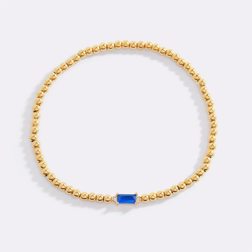Pulsera de cuentas doradas con piedra natal