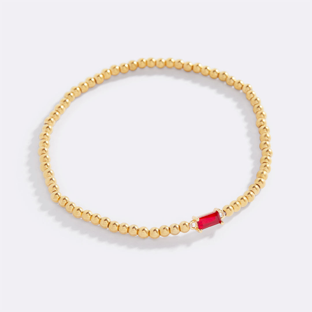 Pulsera de cuentas doradas con piedra natal