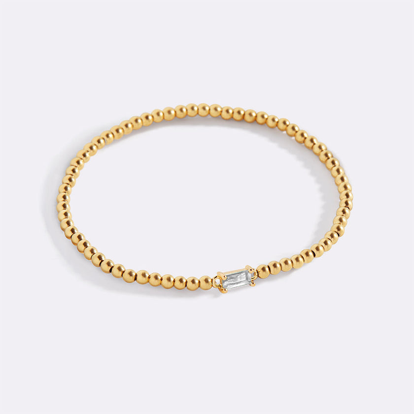 Pulsera de cuentas doradas con piedra natal