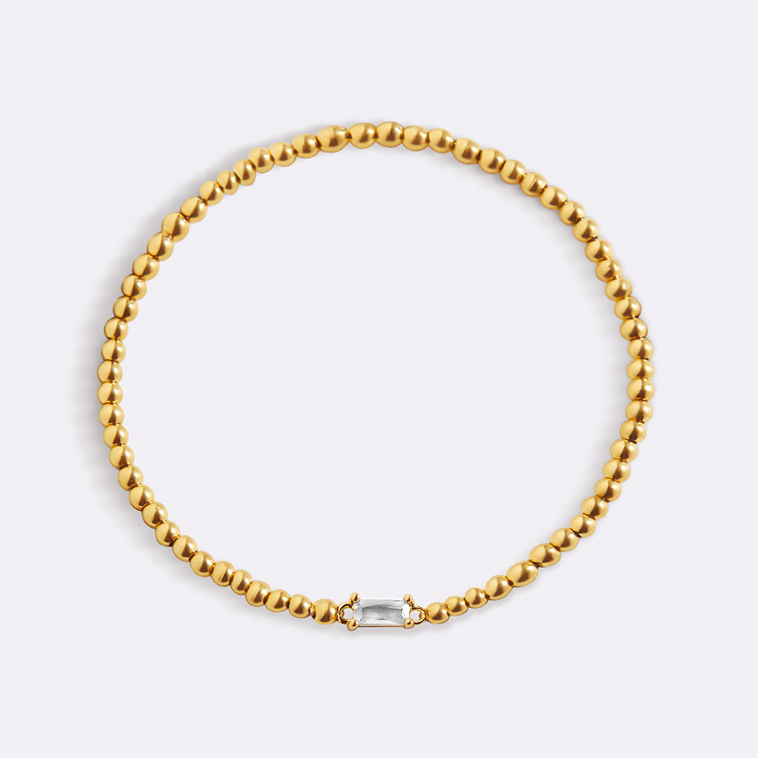 Pulsera de cuentas doradas con piedra natal
