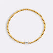 Pulsera de cuentas doradas con piedra natal
