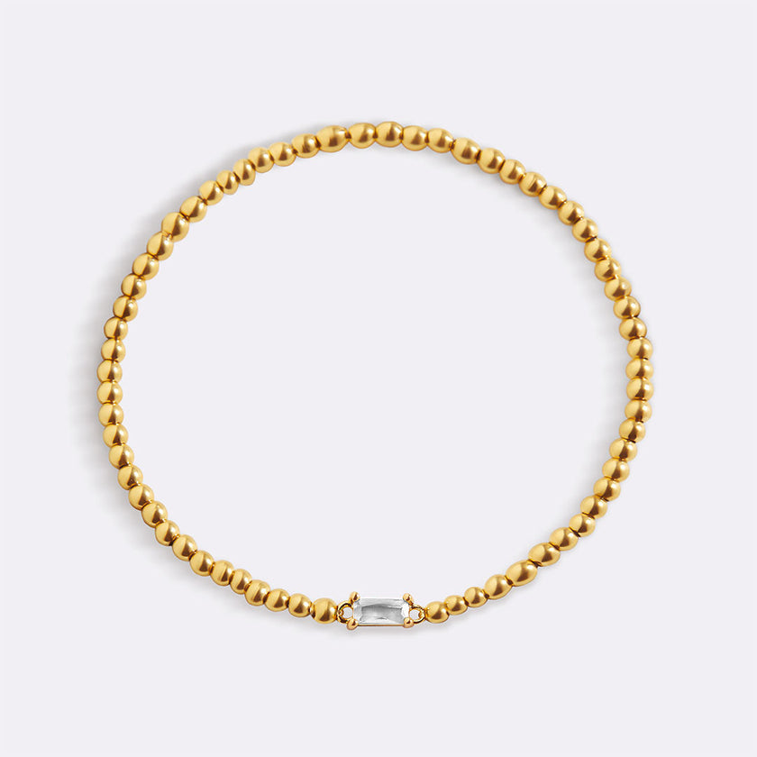 Pulsera de cuentas doradas con piedra natal