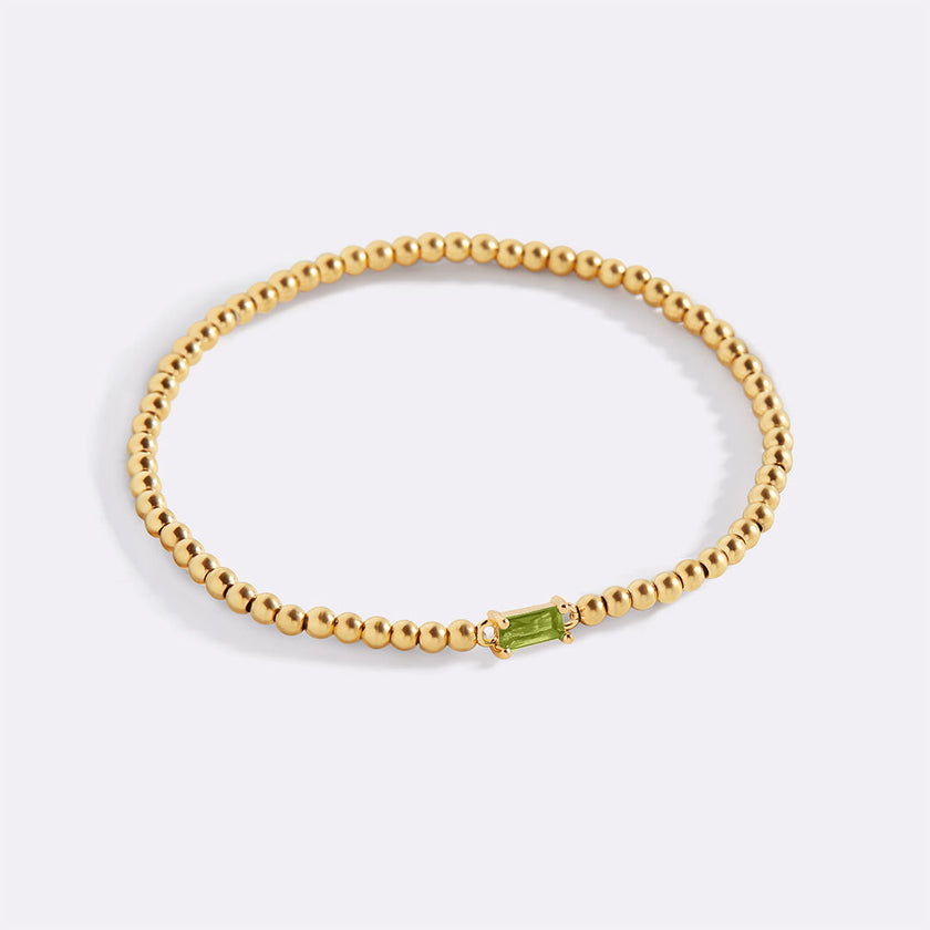 Pulsera de cuentas doradas con piedra natal