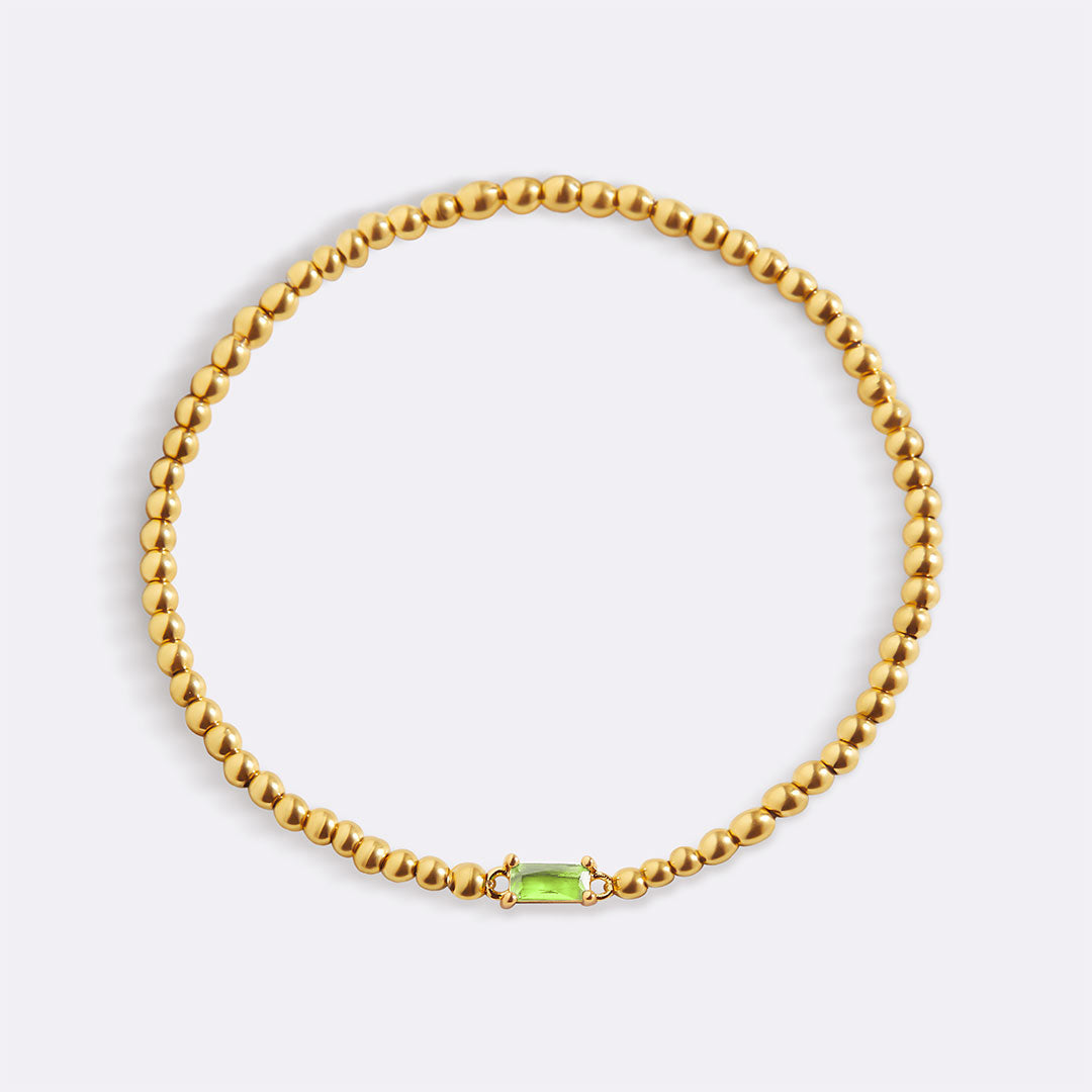 Pulsera de cuentas doradas con piedra natal