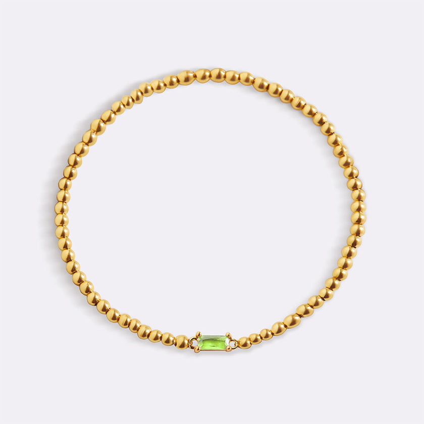 Pulsera de cuentas doradas con piedra natal