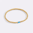 Pulsera de cuentas doradas con piedra natal