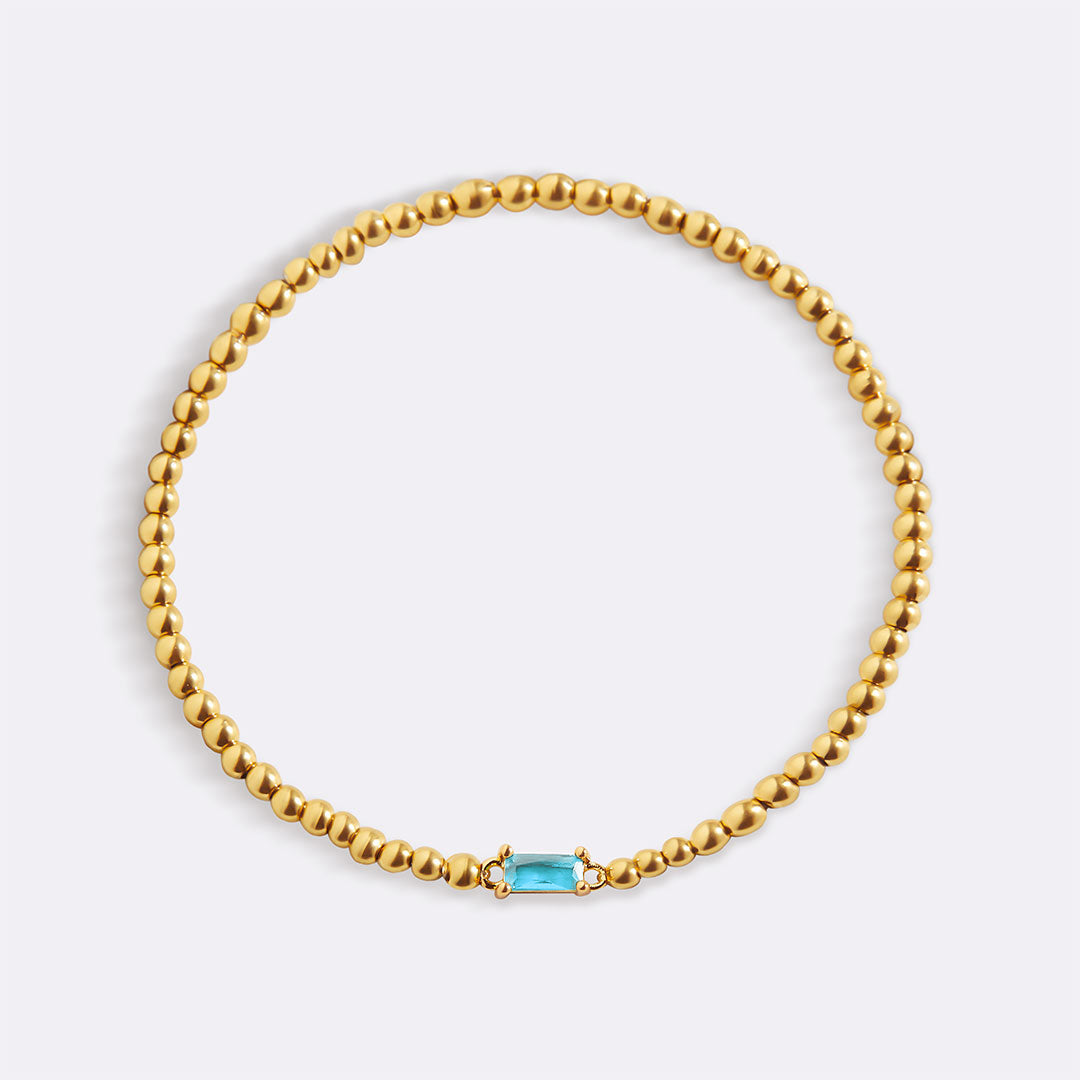 Pulsera de cuentas doradas con piedra natal