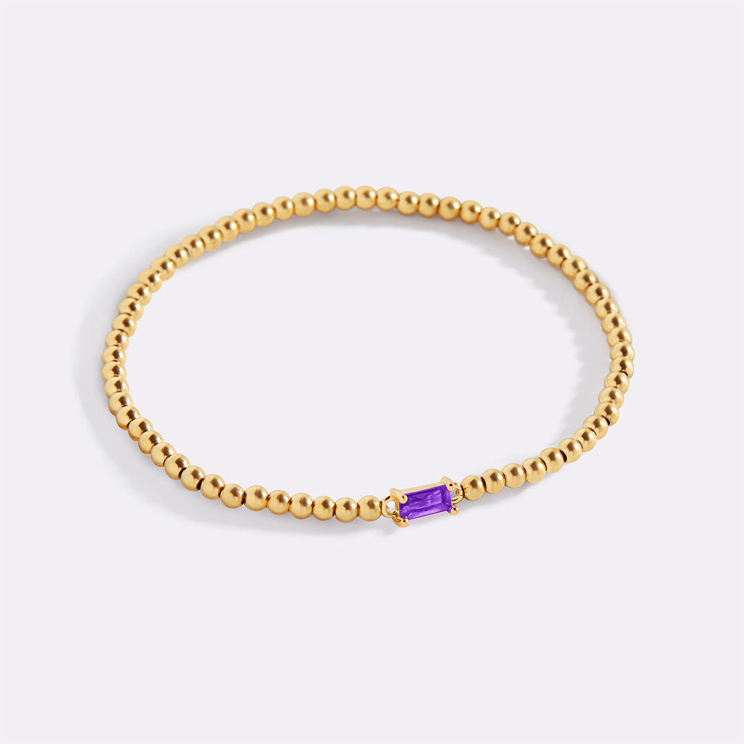 Pulsera de cuentas doradas con piedra natal