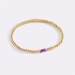 Pulsera de cuentas doradas con piedra natal