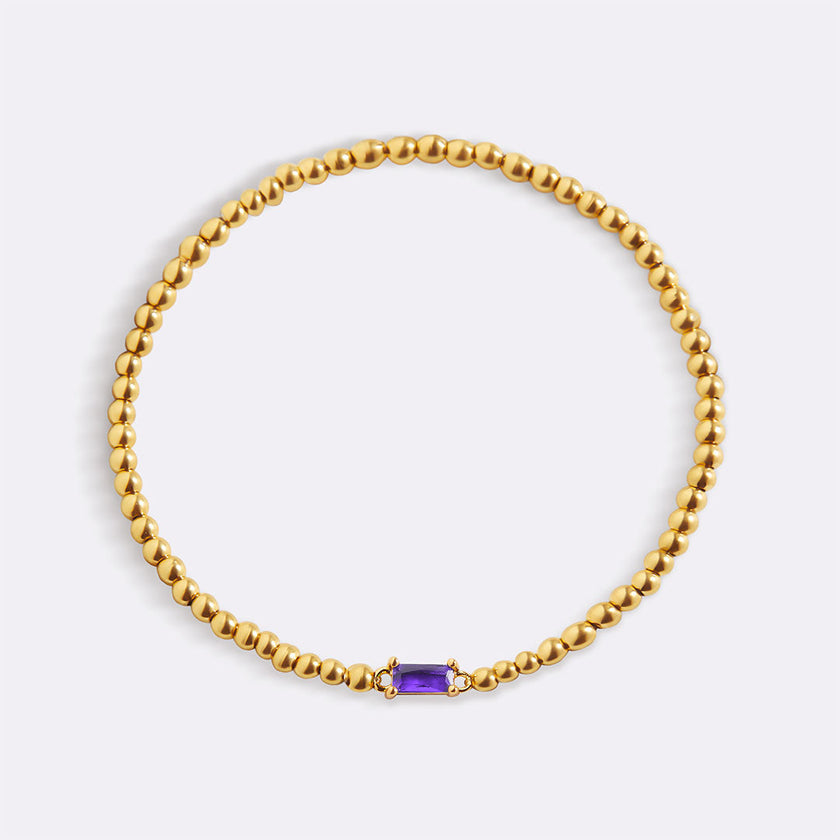 Pulsera de cuentas doradas con piedra natal
